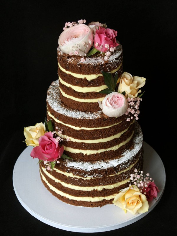 Naked wedding cake with fresh berries