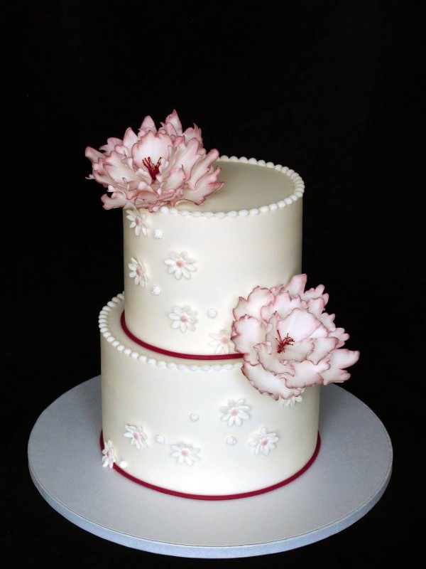 Wedding cake with big burgundy flowers