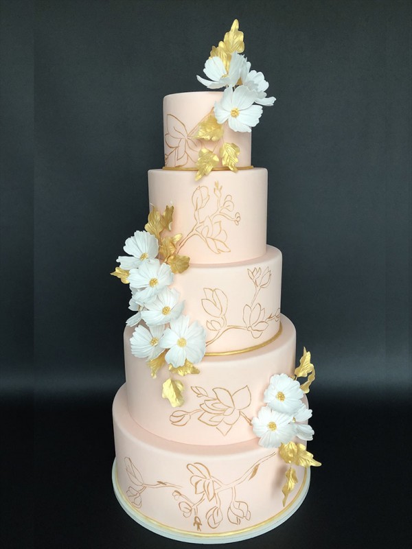 Wedding cake with summer flowers and gold