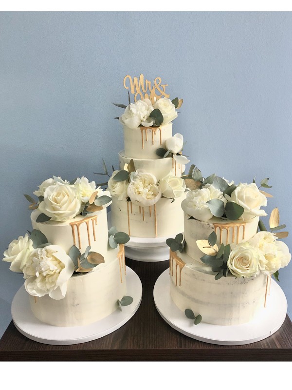 Trio wedding cake with gold and white roses