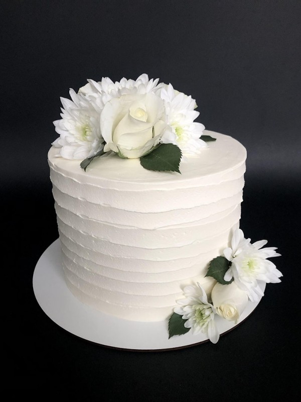 White wedding cake with flowers